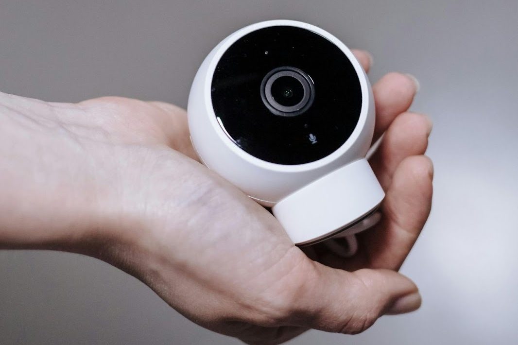 Close up view of hand holding camera