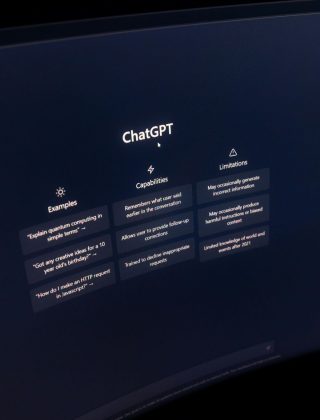 ChatGPT interface displayed on a monitor showing examples, capabilities, and limitations panels