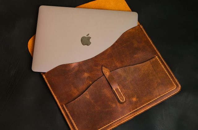 MacBok Air sliding in the leather pouch