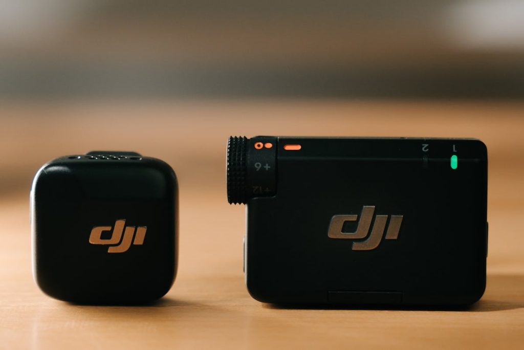 Dji mic mini 2 on the table with dji mic receiver.