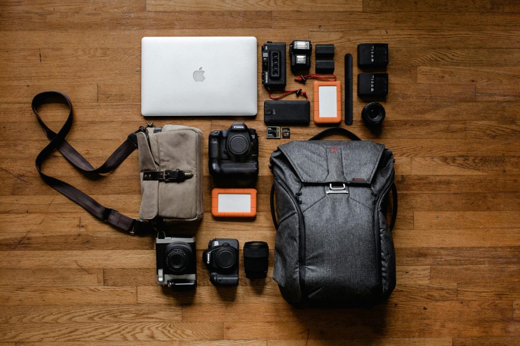 Minimalist carry-on tech kit for digital nomads 2026 flat lay with laptop