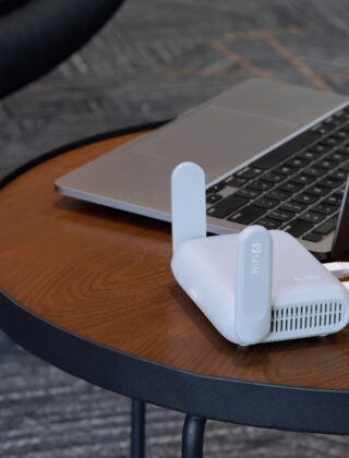 best-travel-router-2026-laptop-coffee-shop-setup.jpg